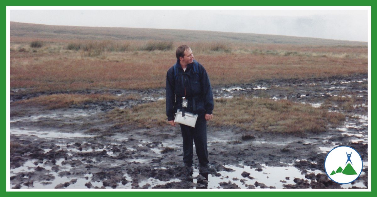 Man standing in a peat bog