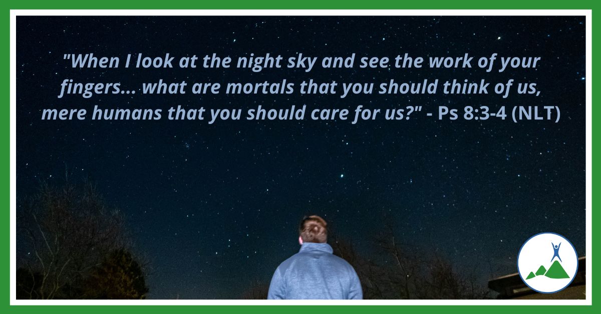 Man looking up at the night sky