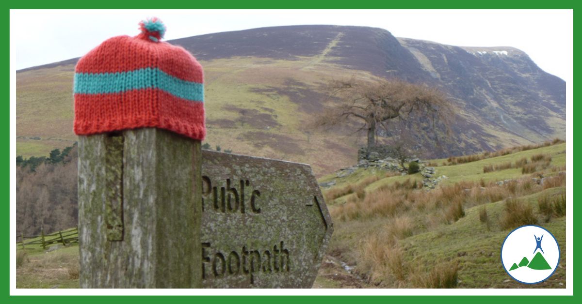 Extreme adventure in the Lake District: wooly hat on footpath sign